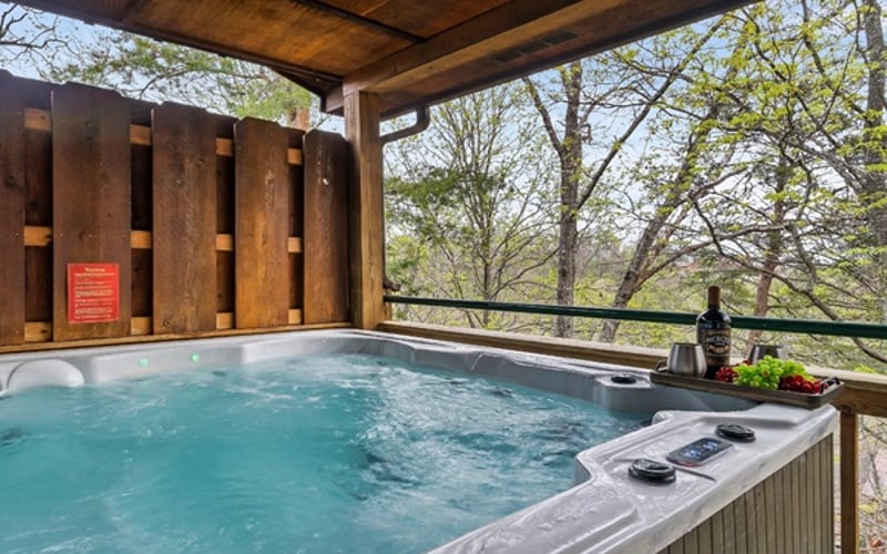 Unwind in your private six-person hot tub on a spacious deck overlooking serene, wooded mountain views. Let the warm jets and peaceful forest backdrop create the perfect end to your day.