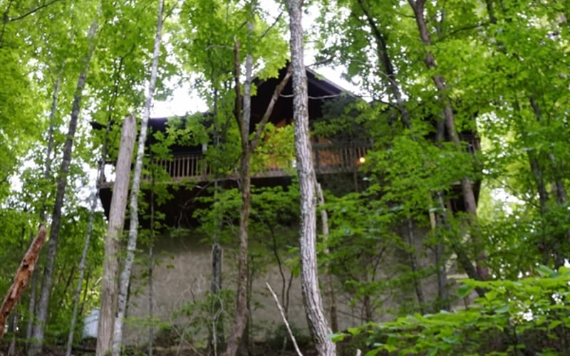 Your private haven nestled in the whispering woods, where the mountains embrace your mornings and the expansive back deck welcomes a day of peaceful solitude. 