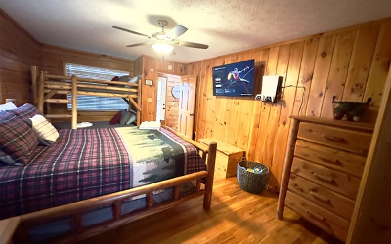 The second En-suite with a Queen bed and log bunk beds. Plenty of room for the whole family!  Brand new Sony PlayStation 5, 50" Roku TV, and Multi-arcade 200+ games!